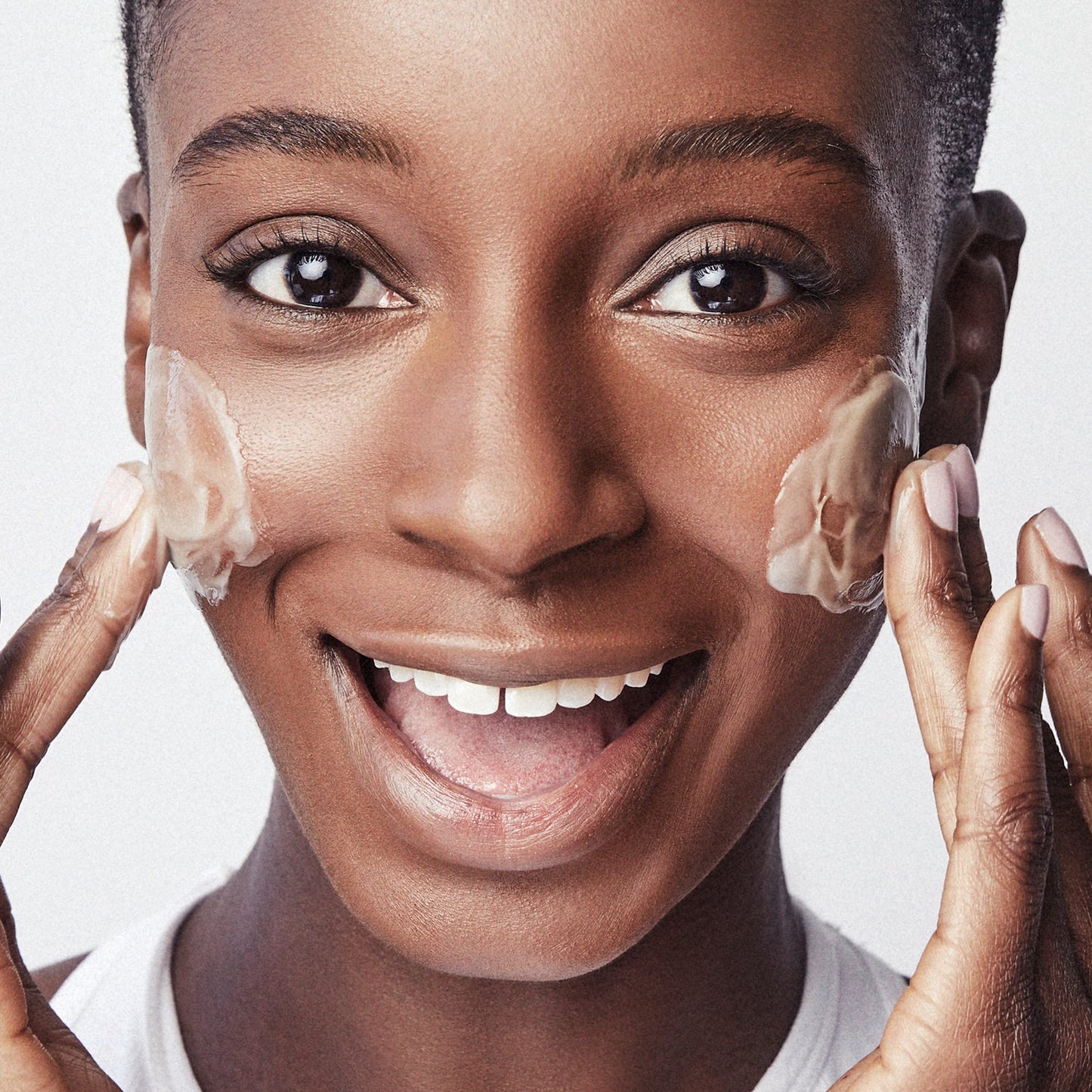 applying fruit enzyme face cleanser collectionhover