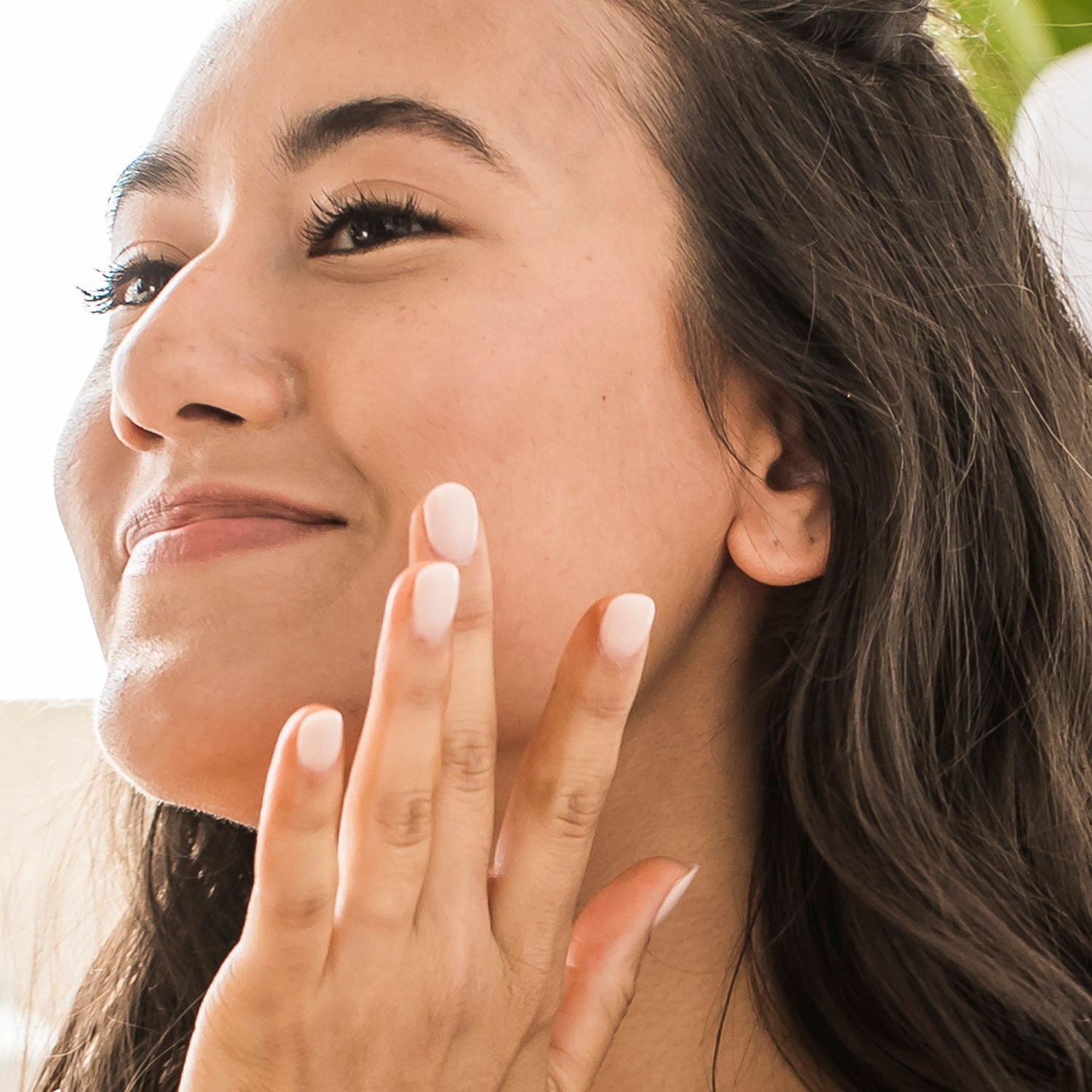 applying moisturizing serum