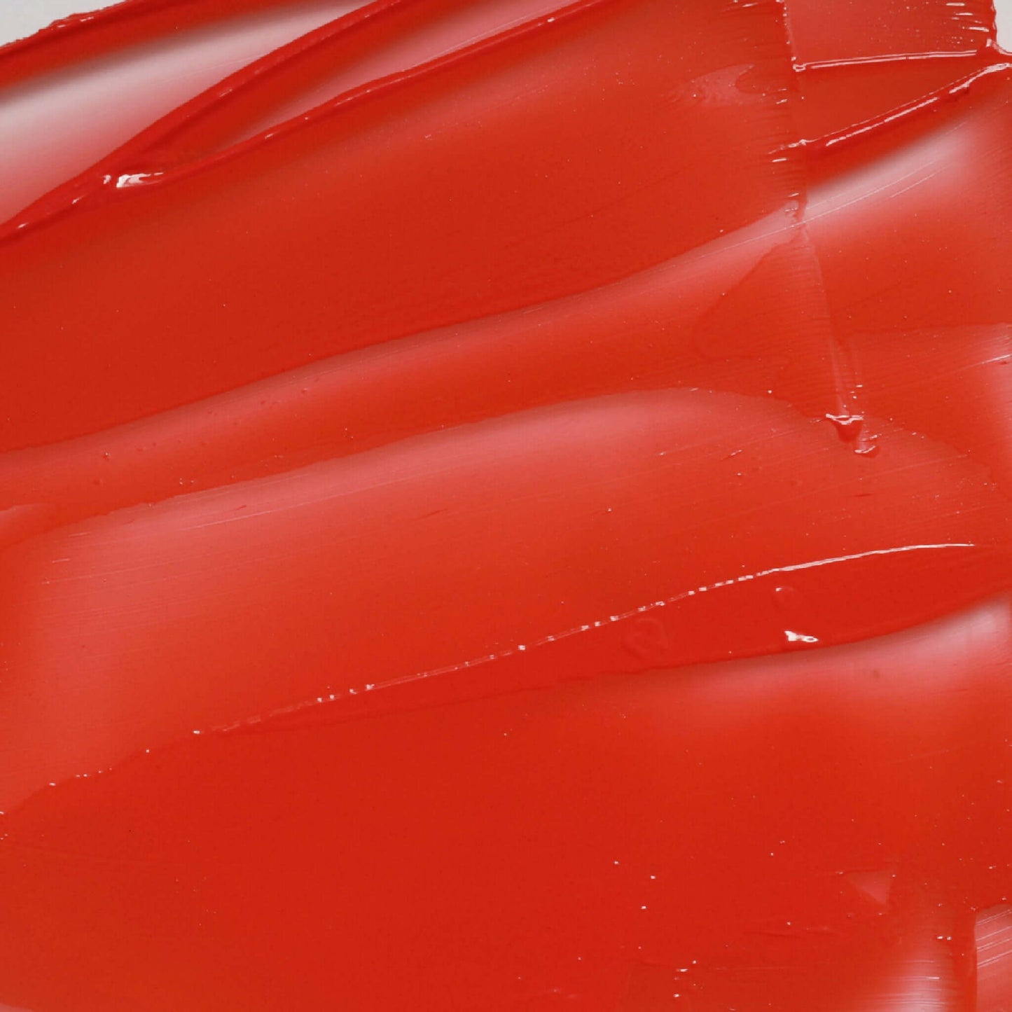 Close-up of Candy Paint Cheek + Lip Tint showing the creamy texture and vibrant color for a buildable and blendable glow.