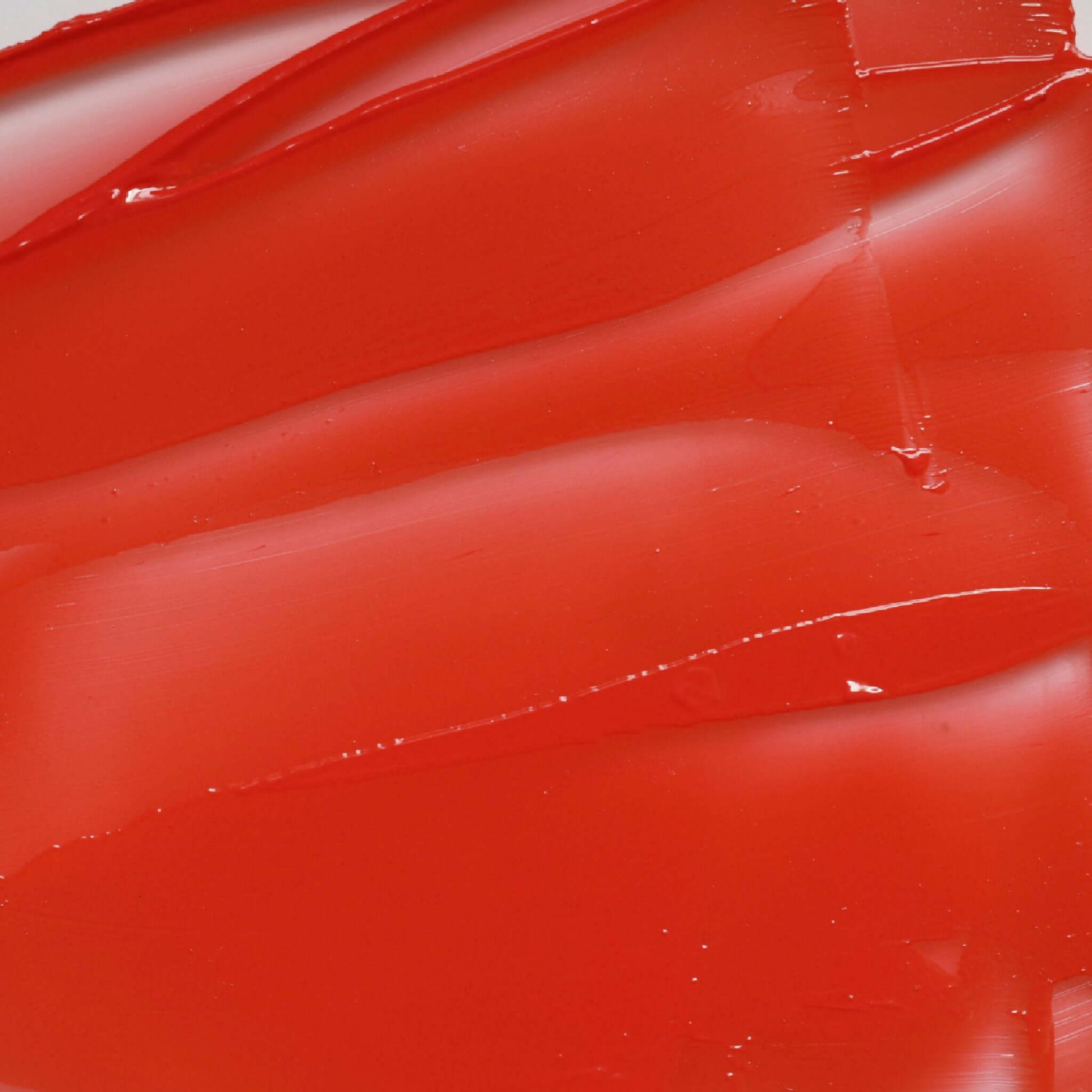 Close-up of Candy Paint Cheek + Lip Tint showing the creamy texture and vibrant color for a buildable and blendable glow.