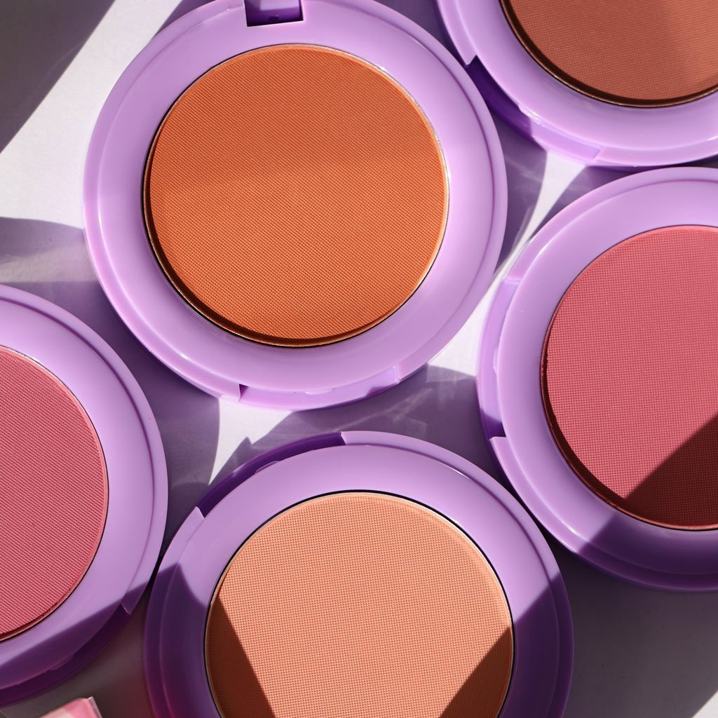 open purple compacts with orange pink and brown pans - In Bloom Powder Blush - Half Caked