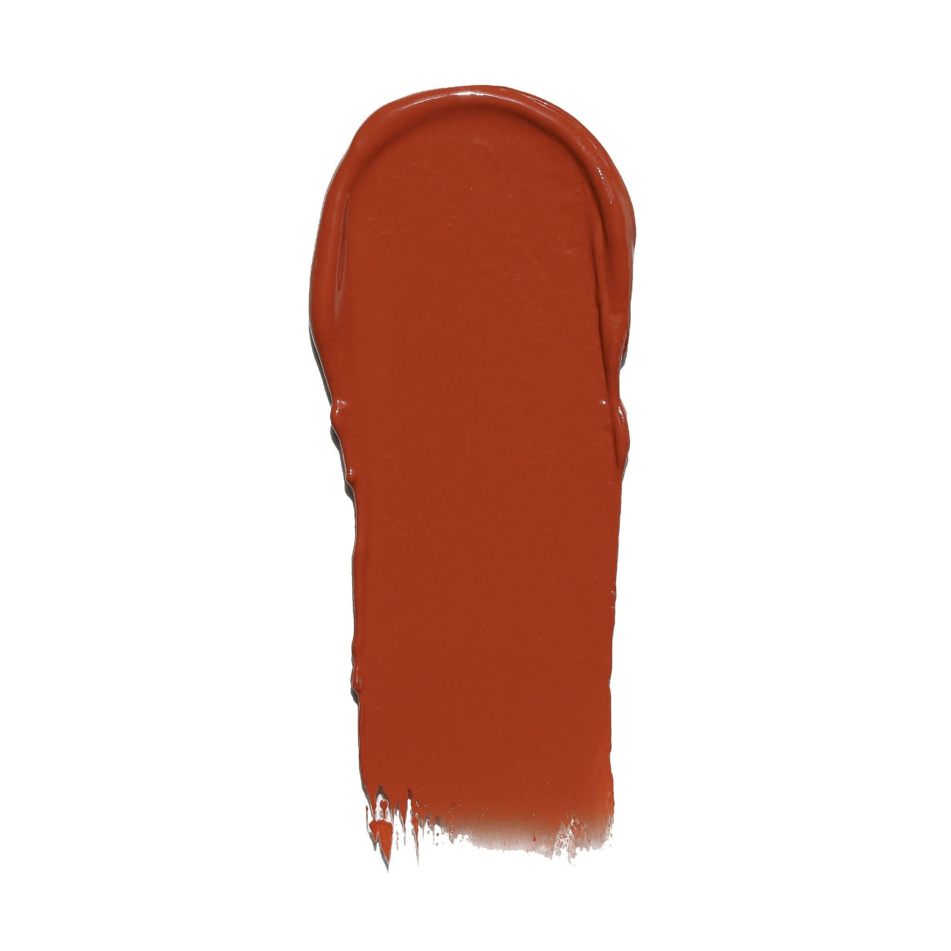 Swatch of Candy Paint Cheek + Lip Tint in warm burnt orange hue, showcasing the creamy texture and dewy finish.