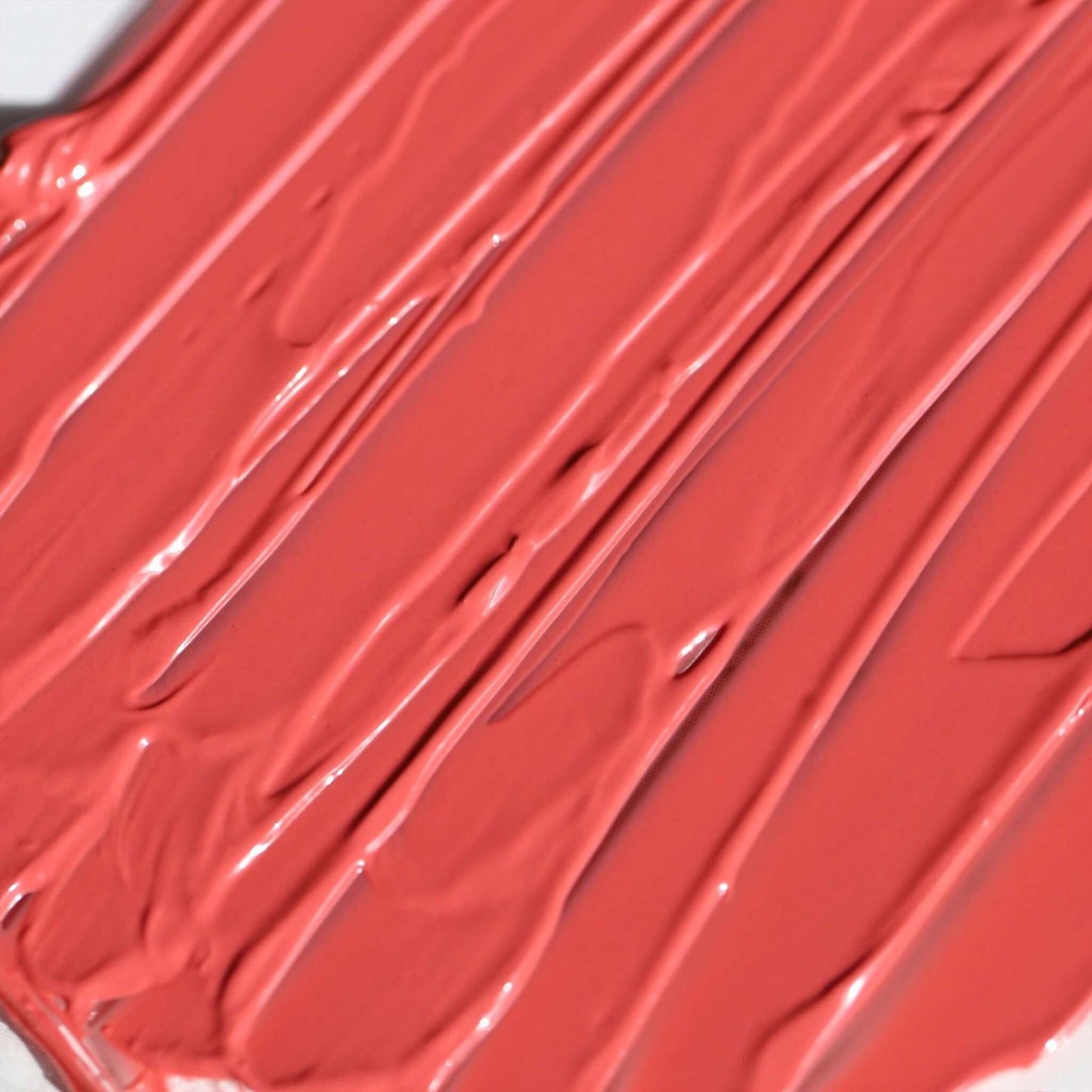 Swatch of Candy Paint Cheek + Lip Tint in a warm-toned, soft mauve shade showcasing its creamy texture and dewy finish.