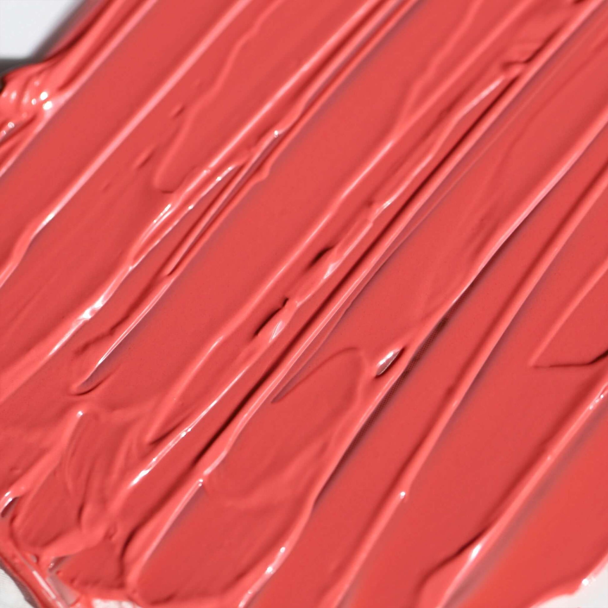 Swatch of Candy Paint Cheek + Lip Tint in a warm-toned, soft mauve shade showcasing its creamy texture and dewy finish.