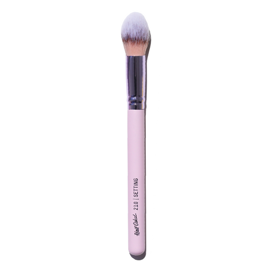 "210 Setting Brush featuring tapered, hand-tied synthetic bristles on a pink wooden handle, designed for expert application of makeup products for a flawless finish."