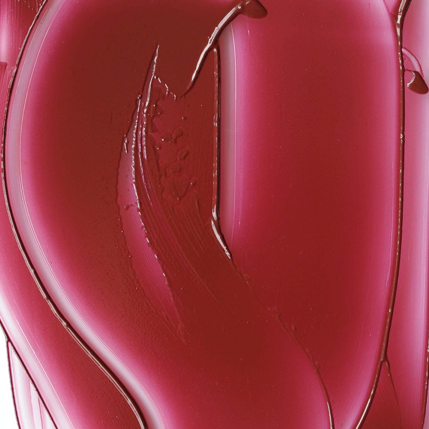 Close-up of Candy Paint Cheek + Lip Tint in a heart-shaped compact with a smooth, blendable cream texture in a vibrant shade, perfect for adding a pop of dewy, radiant color to cheeks and lips.