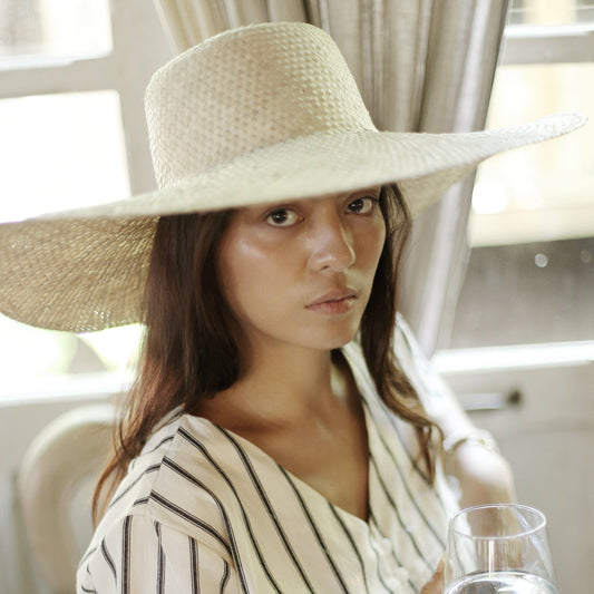 Swasti Wide Round Palm Straw Hat, in Nude Beige by BrunnaCo