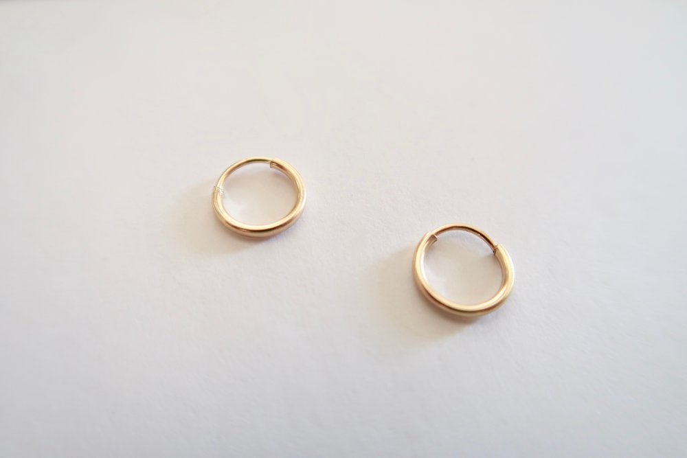 14k Huggie Hoops by Eight Five One Jewelry